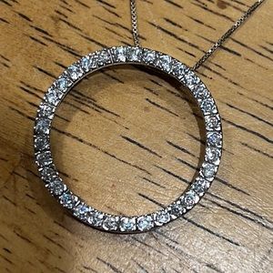 Silver circle necklace with clear colored stones. Nice box linked chain.